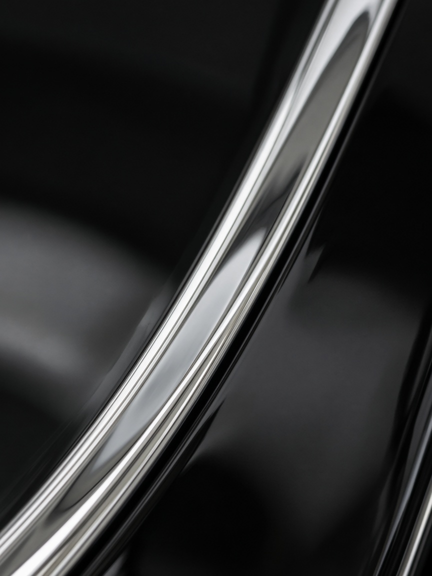 Polished chrome trim against black paint.